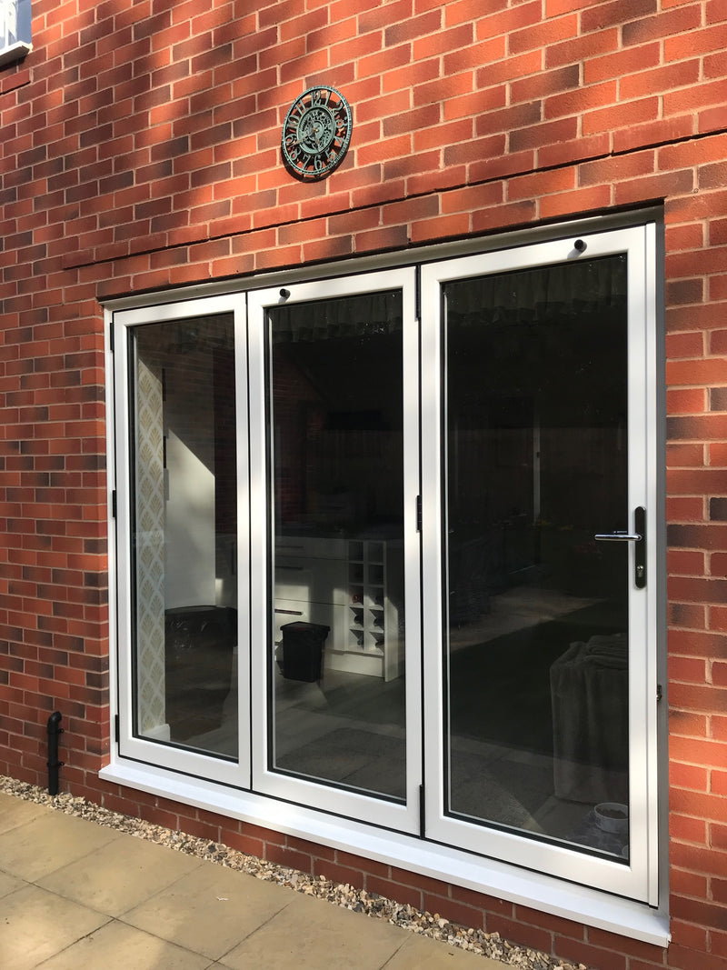 Window with metal frame on a brick wall