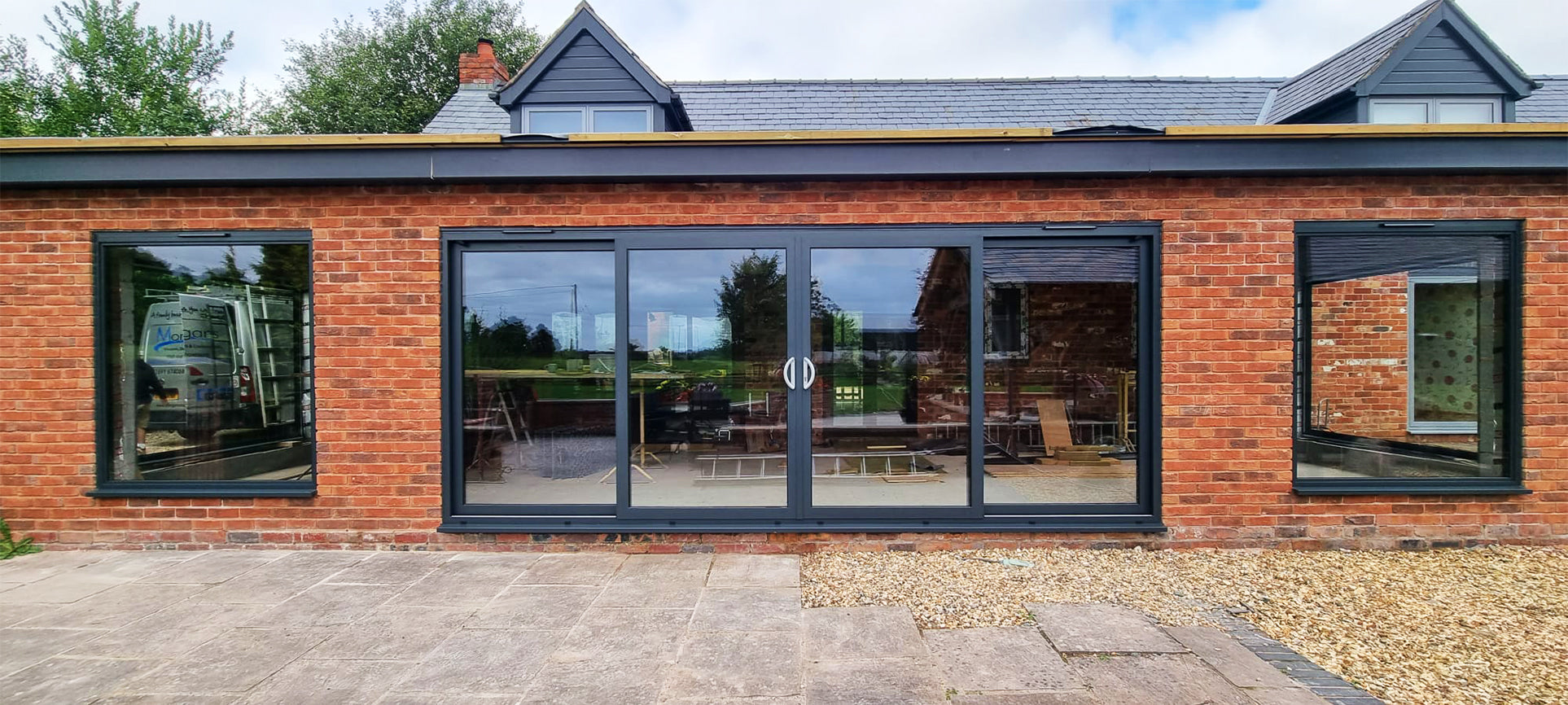 Modern house with large windows and a brick exterior